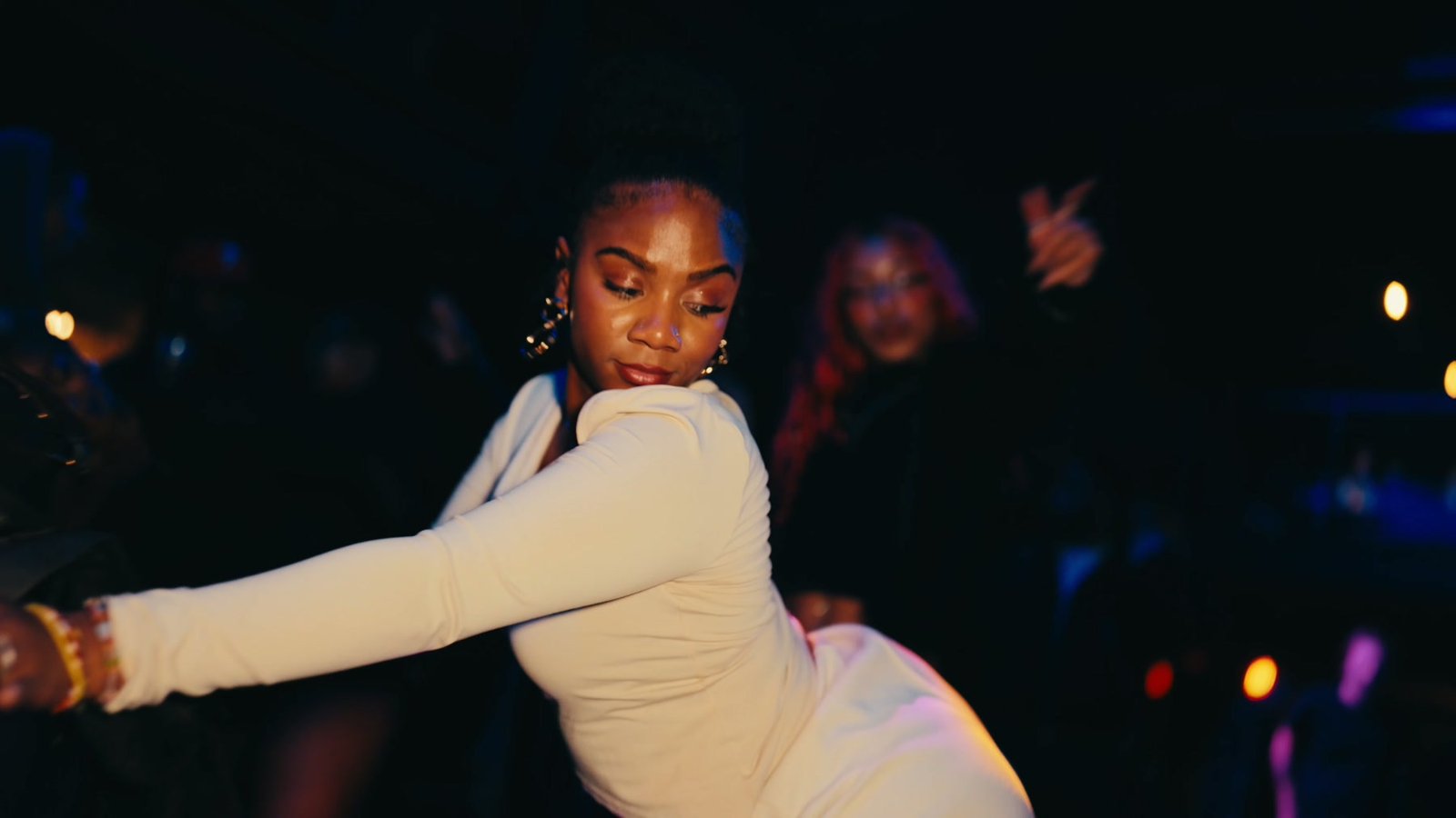 A guest dancing in a white dress on the floor at Fabrika Events in Fishtown